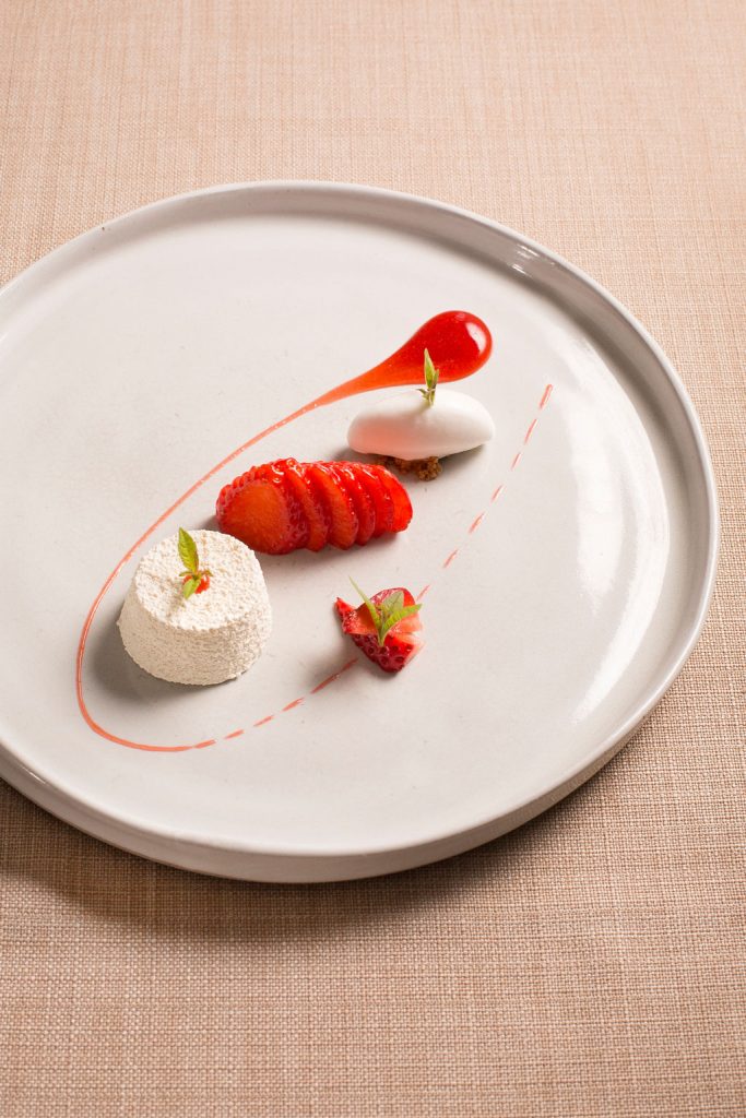 Dessert at so-lo strawberry and lemon verbena on a white plate food photographer liverpool
