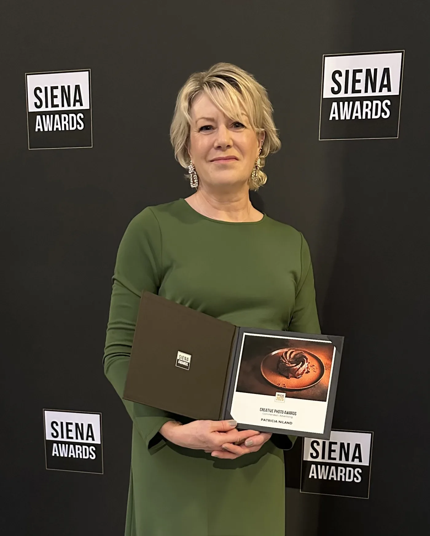 Patricia Niland award winning Photographer recieving her award at the Siena Awards Italy 2025